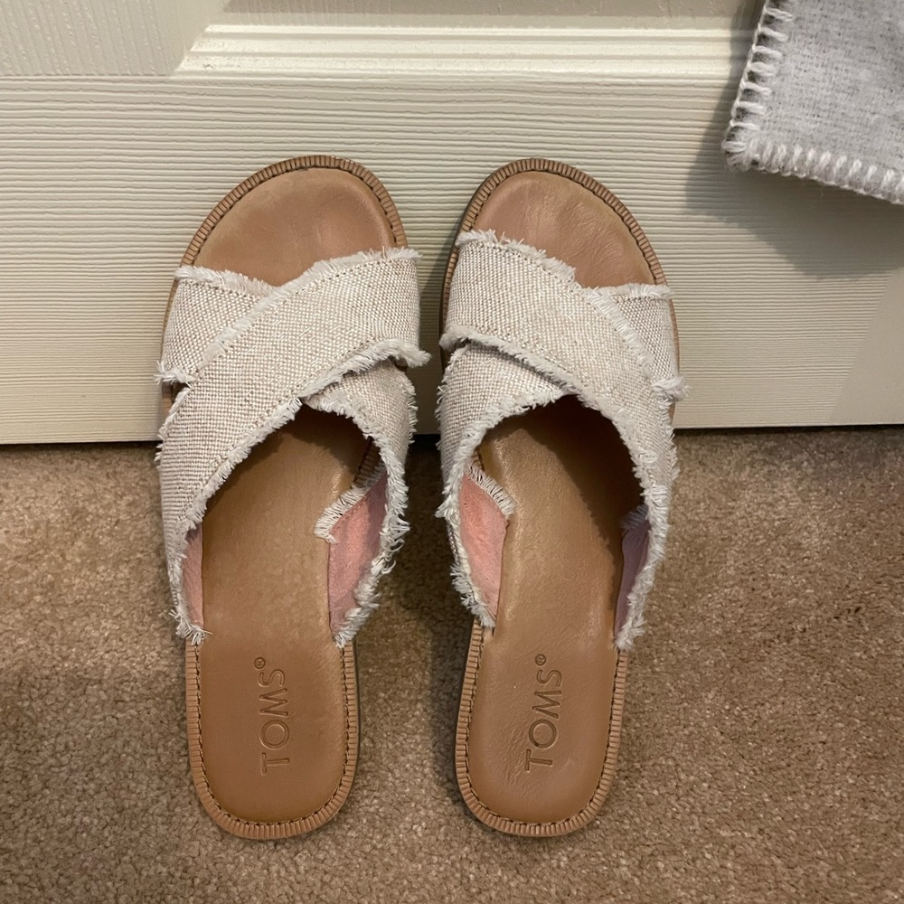 Toms white sandals.